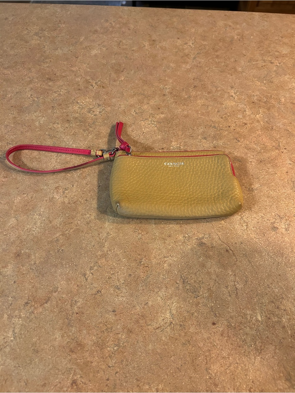 Coach Pebbled Leather Wristlet in neutral with Pink Trim